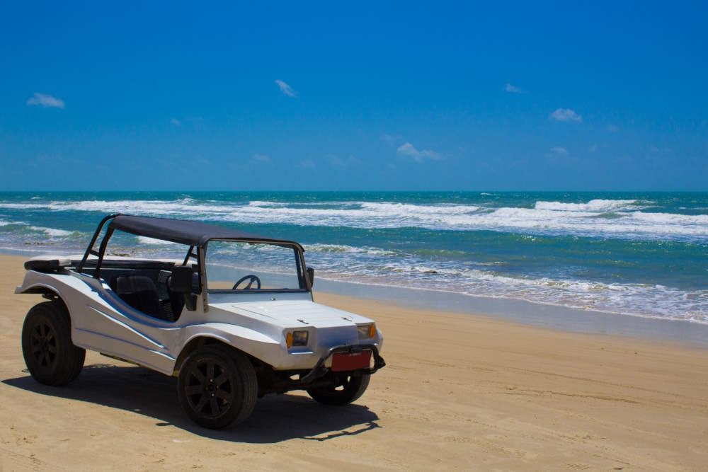 Image of a high-end fancy dune buggy on the beach at theNew Jersey shore.