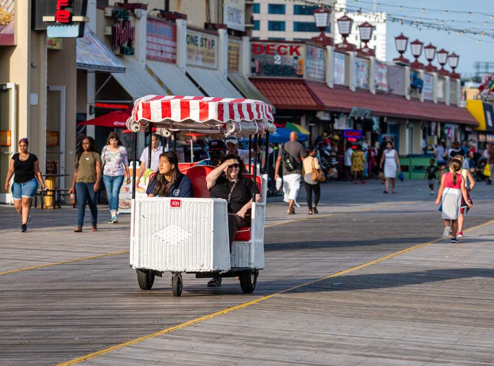 Image of 2 people being pushed in a pedicab in Atlantic City NJ